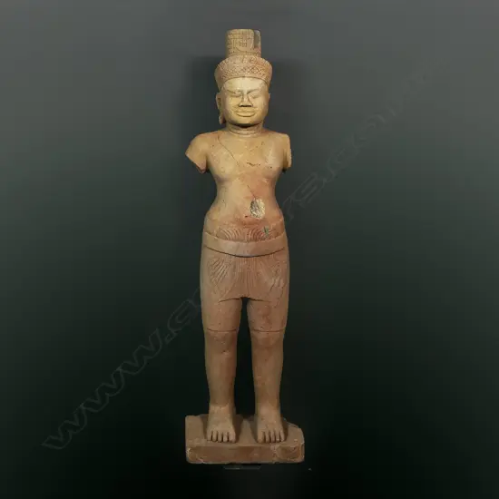A Khmer sandstone figure of a Hindu deity,